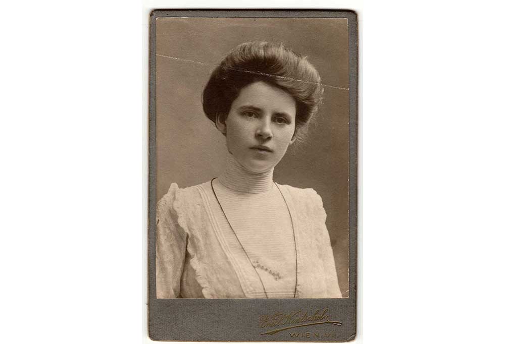 Card style photograph of Victorian woman with photographers mark on the card bottom